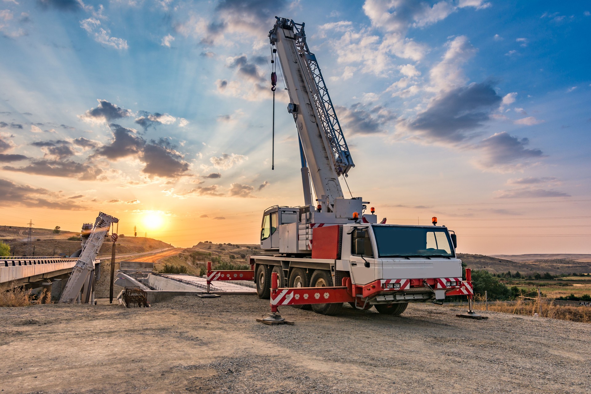 Crane trucks in the construction of a bridge
